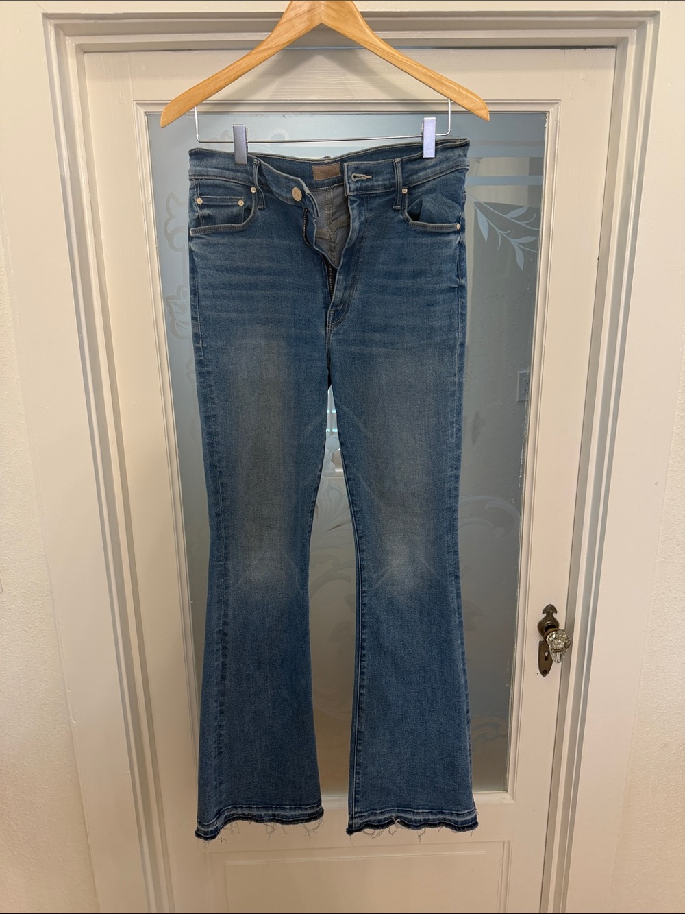 MOTHER Classic Medium Blue Flare Jeans with Raw Hem